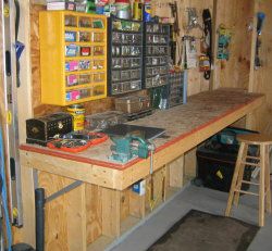 This rugged, simple workbench was built along my garage wall to ...