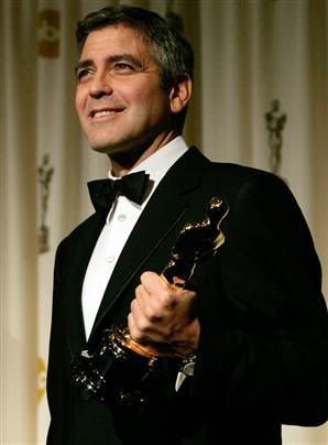 George Clooney oscar photo: he made me proud-George Clooney and his Oscar 060306_clooney_vmed_2p.jpg